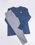 Pageant Blue Black Label long sleeve top paired with grey trousers, showing original chest embellishment.
