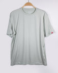MOVE Sport Apparel men’s Essential Short Sleeve: Heather Aqua Glass shirt hanging against a pale background.