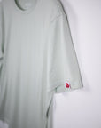 MOVE Sport Apparel men’s Essential Short Sleeve: Heather Aqua Glass shirt showing its original sleeve tab.