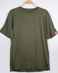 MOVE Sport Apparel men’s Essential Short Sleeve: Heather Hunter Green shirt shown from the front on a hanger.
