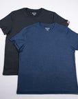 Asphalt charcoal and Midnight Sail blue merino tees arranged together from the front.