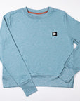 MOVE sport apparel women's heathered blue long sleeve crewneck sweatshirt with ribbed cuffs and side-slit hem.