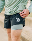 MOVE sport apparel Agility 6 inch black training shorts with grey boxer brief liner and reflective logo detail