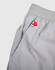 MOVE sport apparel Agility training shorts in light grey with perforated fabric and red logo tab on the pocket