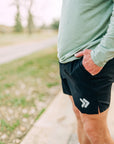 MOVE sport apparel Agility 6 inch training shorts in black with side slit and reflective logo detail