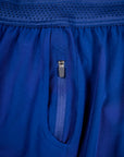 MOVE sport apparel blue men's running shorts featuring a breathable waistband and a secure zippered pocket.