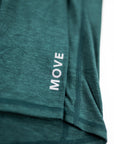 MOVE sport apparel women's essential quarter zip in dark green heathered fabric with a reflective logo detail