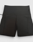 MOVE sport apparel black high-rise athletic performance shorts with side pockets and moisture-wicking fabric.