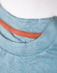 MOVE sport apparel heathered blue crewneck sweatshirt with a contrasting orange inner neck trim