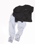 MOVE sport apparel charcoal crewneck sweatshirt and light grey joggers set with signature branding on white background