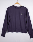 MOVE sport apparel women's dark purple long sleeve crewneck sweatshirt with ribbed cuffs and side-slit hem