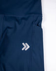 MOVE Sport Apparel women’s 25-Inch Running Tights: Close view of the side pocket and original thigh chevrons on Pageant blue tights.