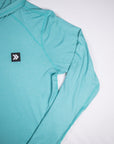 MOVE Sport Apparel women’s Black Label Lightweight Sun Hoodie: Close view of the original chest patch and sleeve on the Aqua Splash sun hoodie.