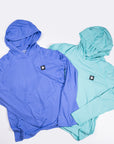 MOVE Sport Apparel women’s Black Label Lightweight Sun Hoodie: Deep Periwinkle and Aqua Splash sun hoodies arranged together.