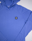 MOVE Sport Apparel women’s Black Label Lightweight Sun Hoodie: Close view of the neckline and original black square chest patch on the Deep Periwinkle sun hoodie.