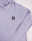 MOVE Sport Apparel women’s Black Label Lightweight Sun Hoodie: Close view of the original black square chest patch on the Icelandic Blue sun hoodie.