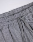 Elastic waistband, stitching and pocket detail on grey Essential Joggers.