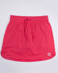 Front view of MOVE Sport Apparel women’s Skort in Paradise Pink with drawstring waist and original lower-hem tab.