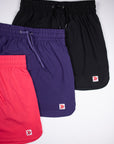 Hem and original double-chevron tab comparison across pink, purple and black skorts.