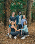 MOVE Sport Apparel women’s Black Label Lightweight Sun Hoodie: Group wearing MOVE Sport Apparel outfits in a woodland setting, including the women’s sun hoodie.