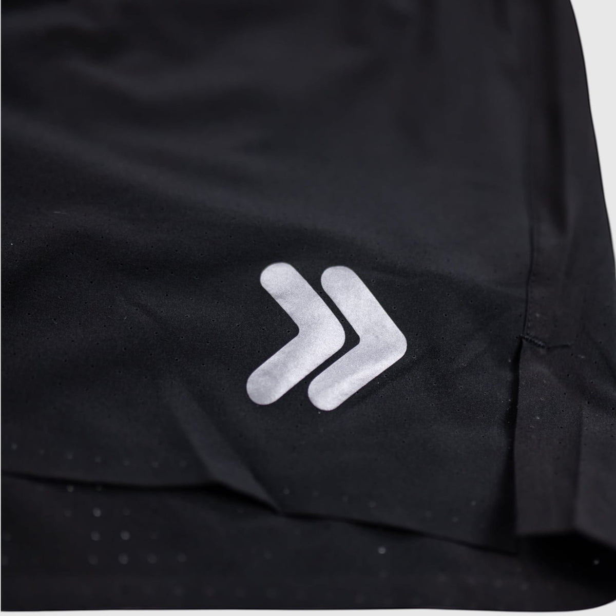MOVE Sport Apparel black Agility training shorts featuring a logo detail and perforated fabric texture