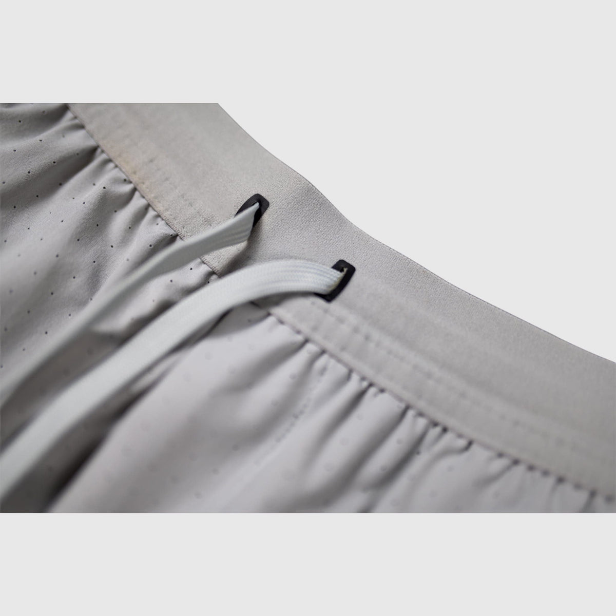 MOVE Sport Apparel Agility 6 inch training shorts in light grey with a drawstring waistband and perforated fabric
