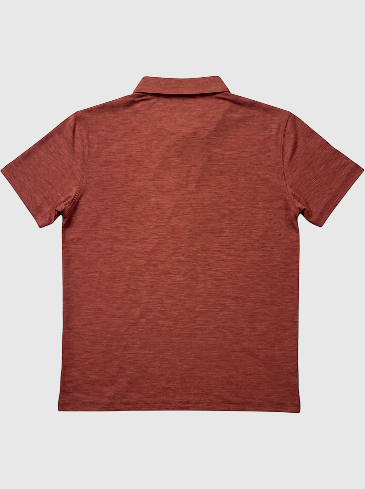 MOVE Sport Apparel Essential Polo Shirt. Mesa Rose polo laid flat, back view.