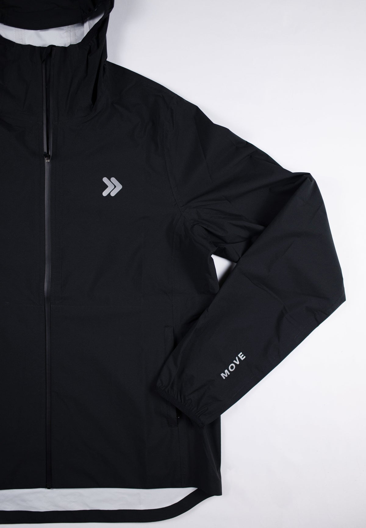 Black MOVE Sport Apparel women’s AquaLight jacket showing chest embellishment and zipper detail.