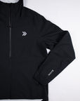 Black MOVE Sport Apparel women’s AquaLight jacket showing chest embellishment and zipper detail.