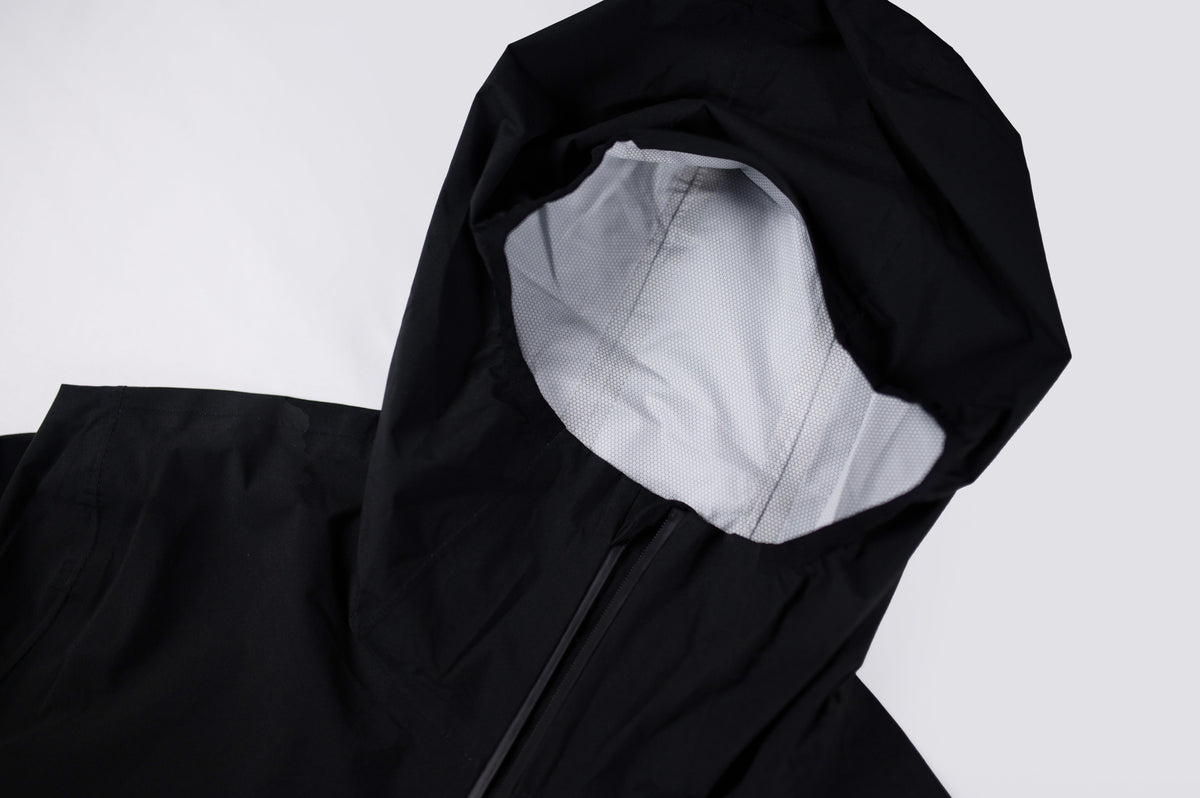 Black MOVE Sport Apparel women’s AquaLight jacket showing hood and mesh lining details.