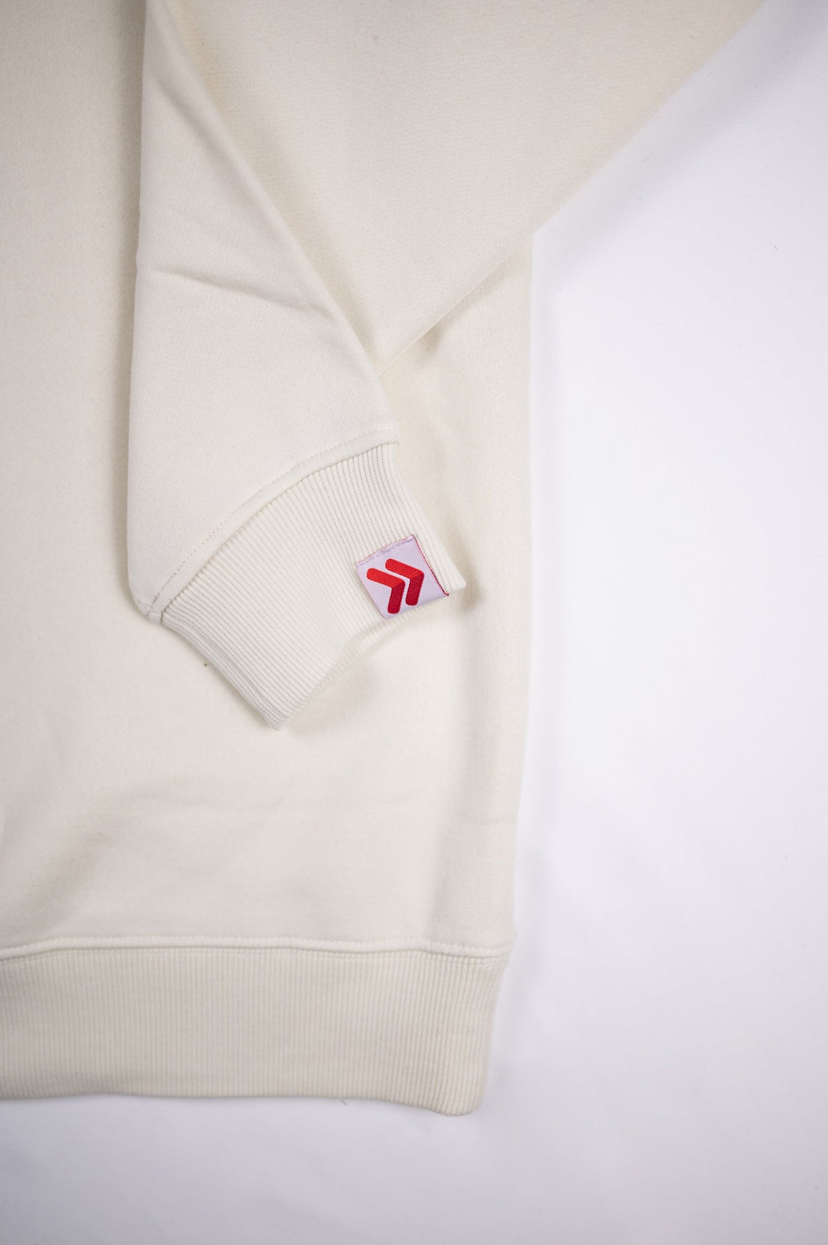 Cream MOVE Sport Apparel Logo Sweatshirt sleeve and cuff detail.