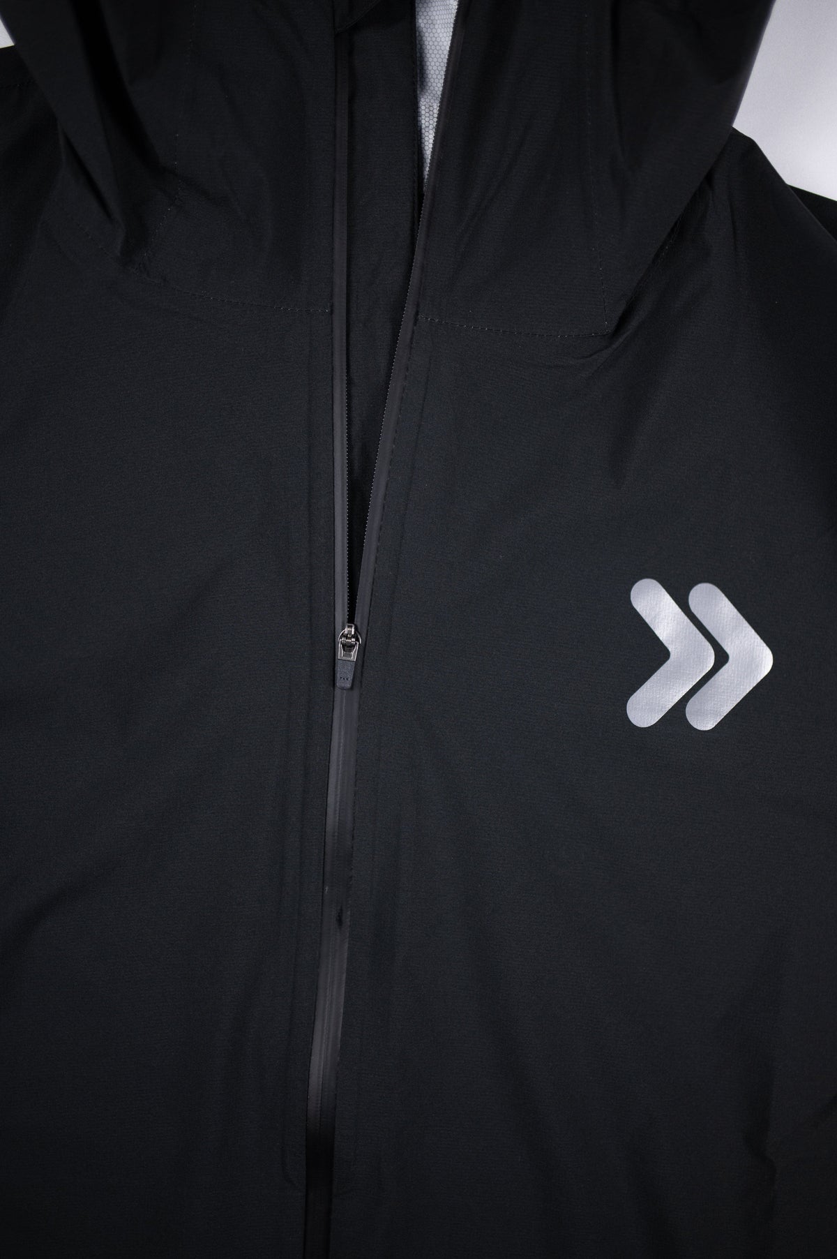 Black MOVE Sport Apparel men’s AquaLight jacket showing its full front zipper.