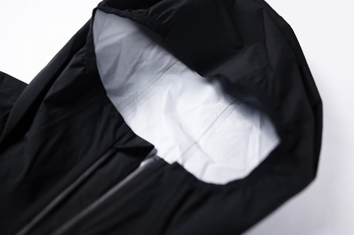 Black MOVE Sport Apparel men’s AquaLight jacket hood showing white interior lining and zipper details.