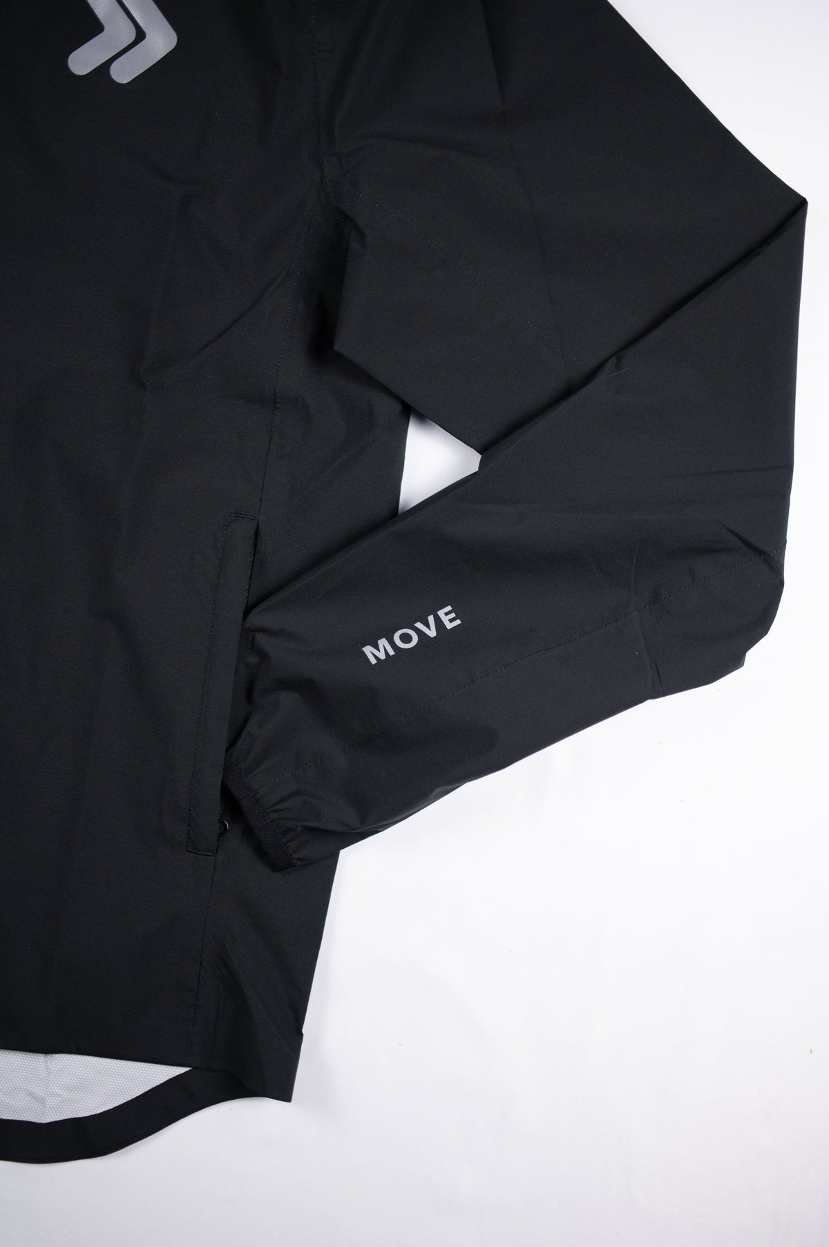 Side pocket and sleeve detail of the black MOVE Sport Apparel men’s AquaLight jacket.