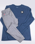 MOVE Sport Apparel Pageant Blue Black Label long sleeve and grey trousers arranged as a flat-lay outfit.