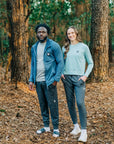 Couple walking through autumn woodland; man wears MOVE Sport Apparel men’s Essential Jogger.