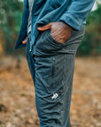 Heather Black MOVE Sport Apparel men’s Essential Jogger shown worn outdoors.