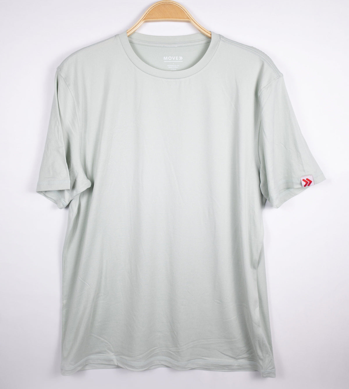 MOVE Sport Apparel men’s Essential Short Sleeve: Heather Aqua Glass shirt shown from the front on a hanger.