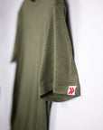 MOVE Sport Apparel men’s Essential Short Sleeve: Heather Hunter Green shirt showing its original sleeve tab.