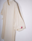 MOVE Sport Apparel men’s Essential Short Sleeve: Heather Sand shirt with a close view of its original sleeve tab.