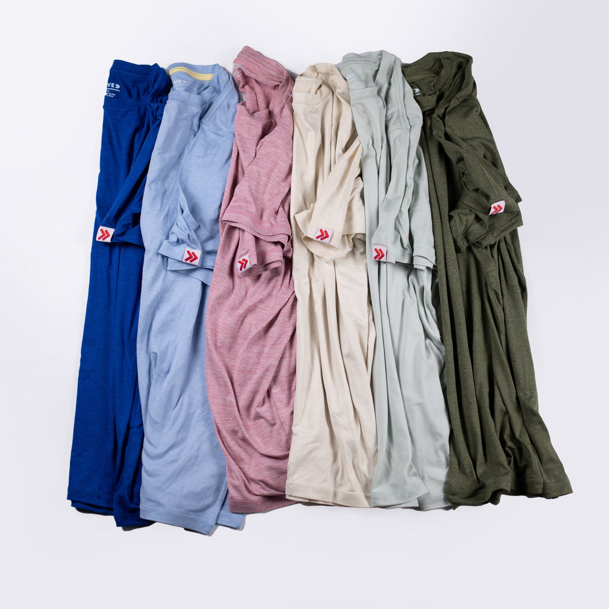 MOVE Sport Apparel men’s Essential Short Sleeve: Six color options arranged to show original red-and-white sleeve tabs.