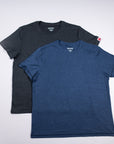 Two MOVE Sport Apparel merino tees in charcoal and blue arranged together.