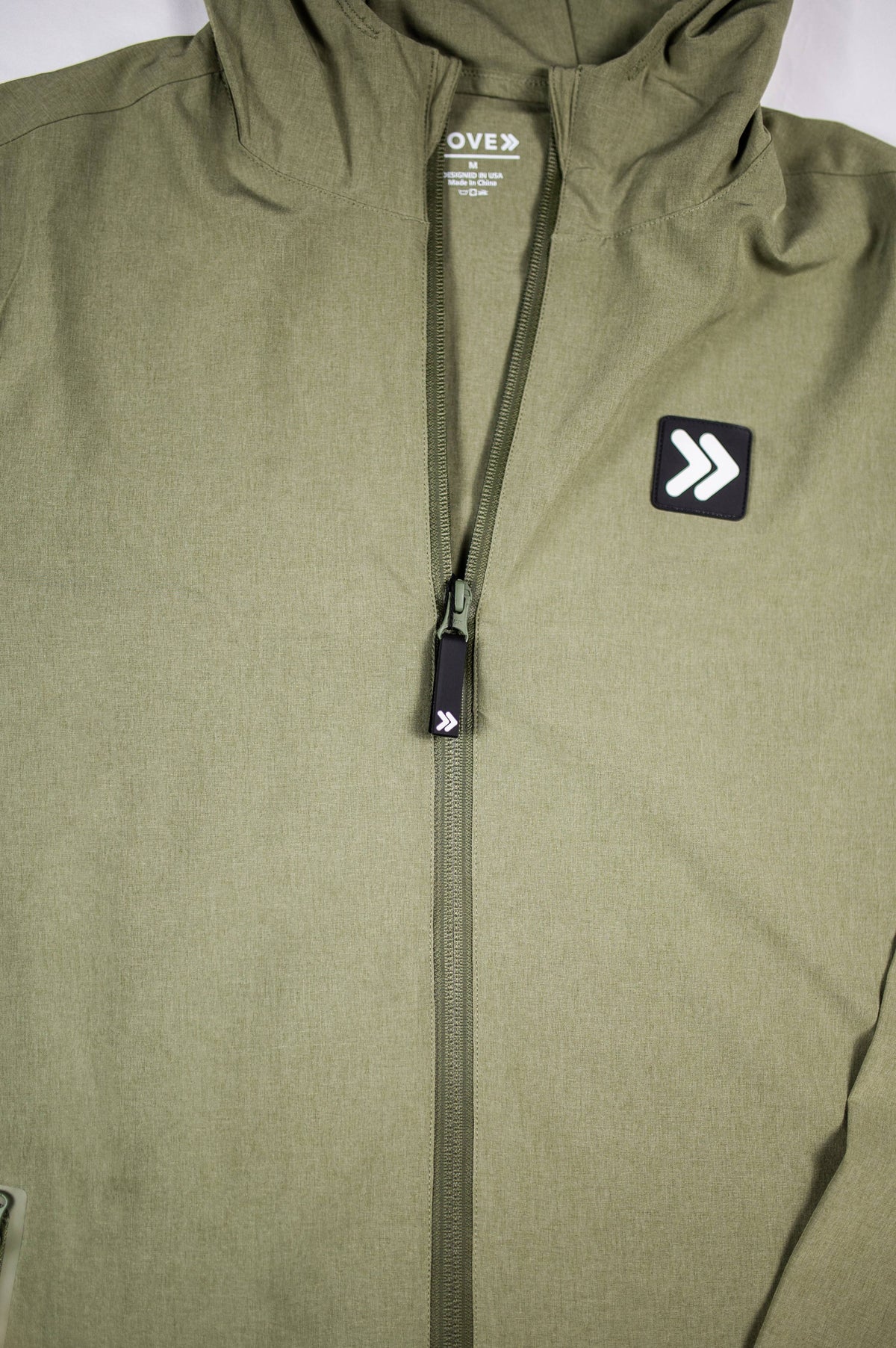 MOVE Sport Apparel men’s Soft Shell Jacket: Cactus jacket collar, front zipper and rounded MOVE chest logo detail.