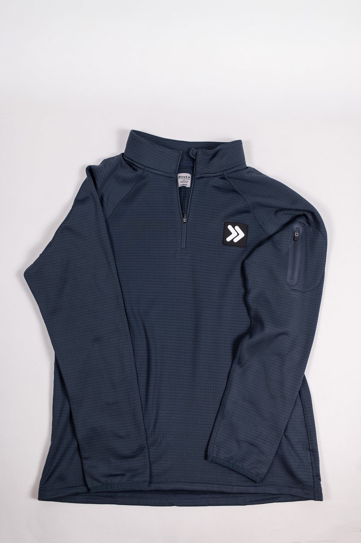 Front flat-lay view of a dark blue MOVE Sport Apparel men’s waffle quarter zip.