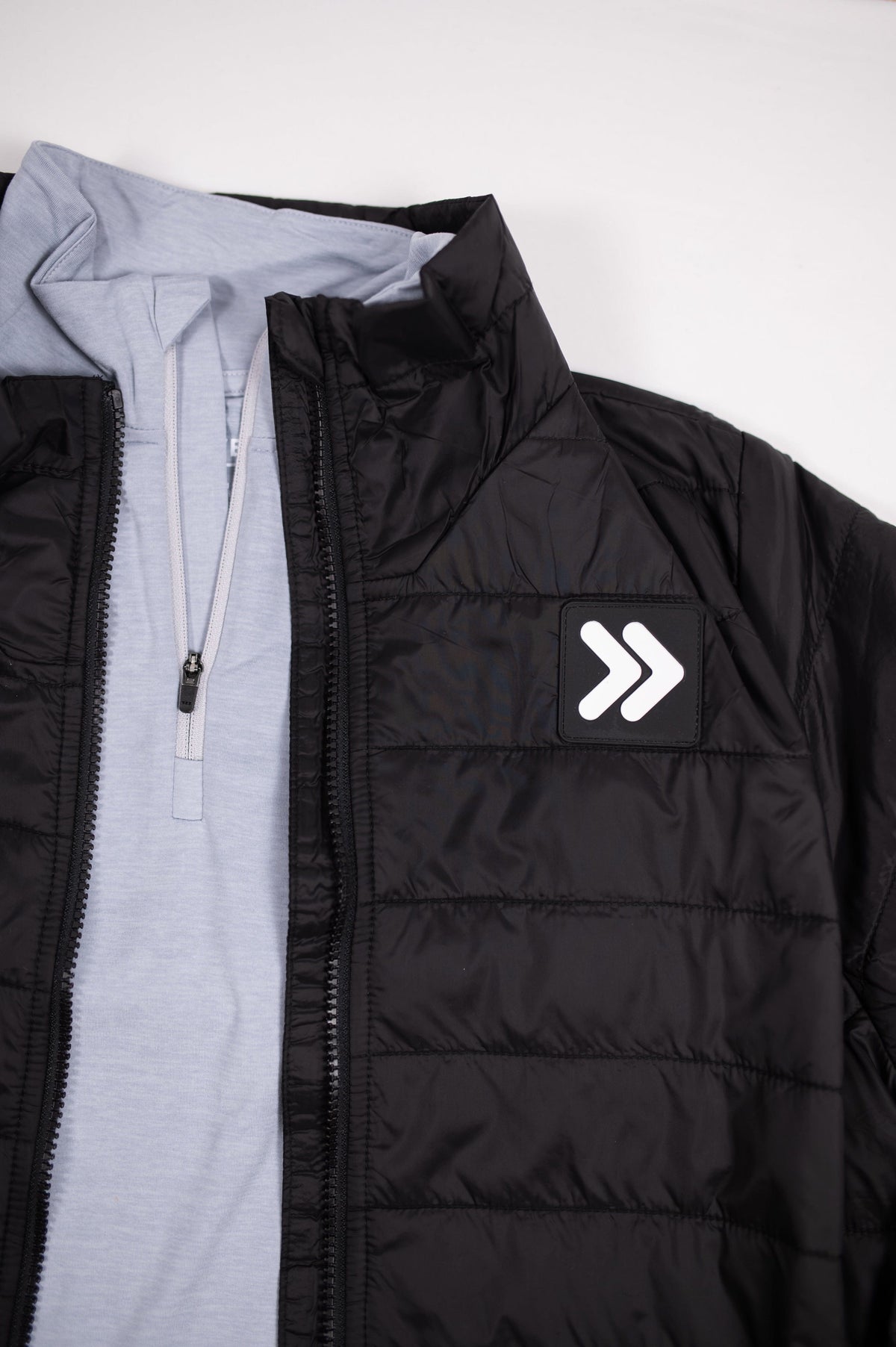 MOVE sport apparel men's black quilted lightweight down jacket with a stand-up collar and white logo patch