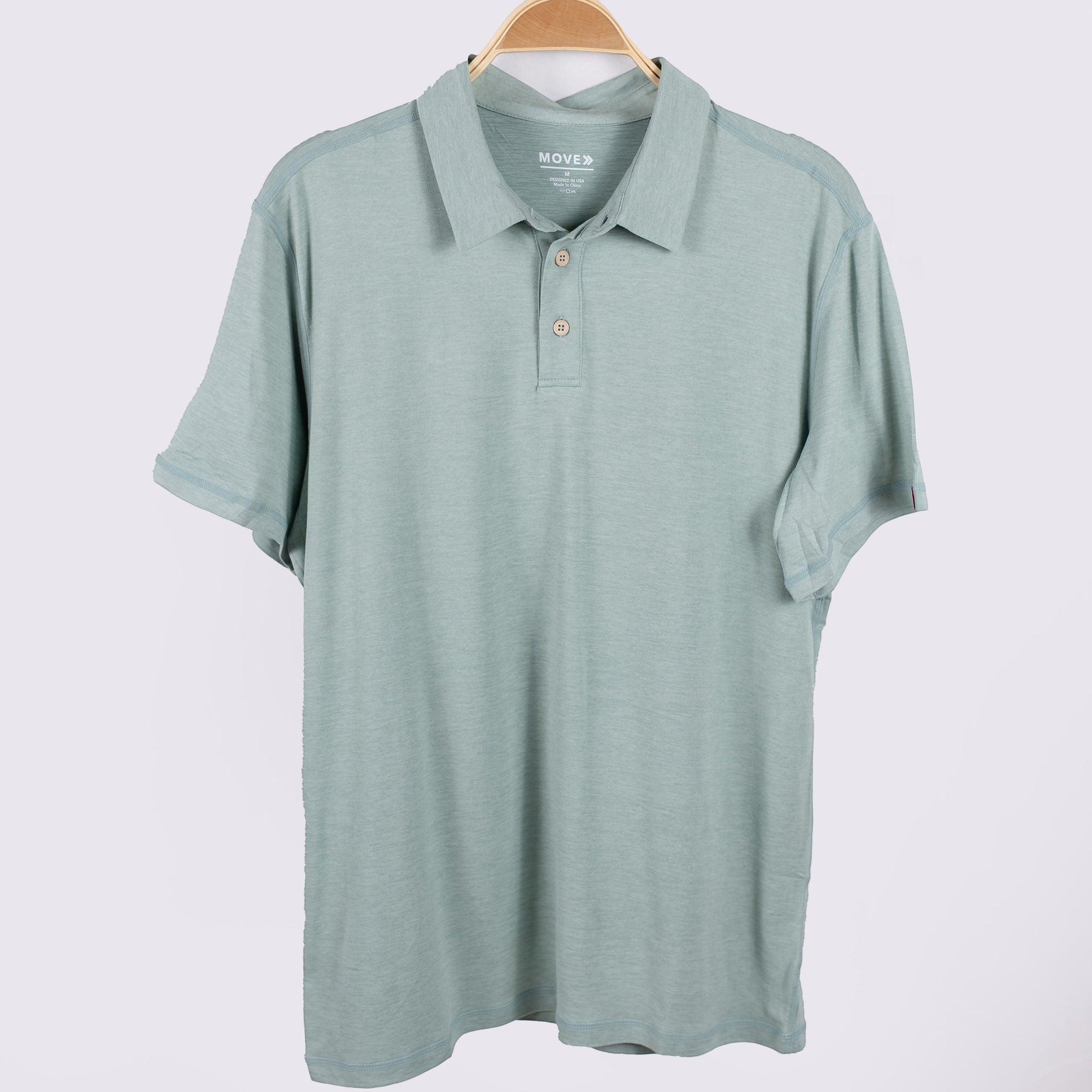 MOVE sport apparel Essential Polo Shirt in sage green moisture-wicking fabric with a classic collar and button placket