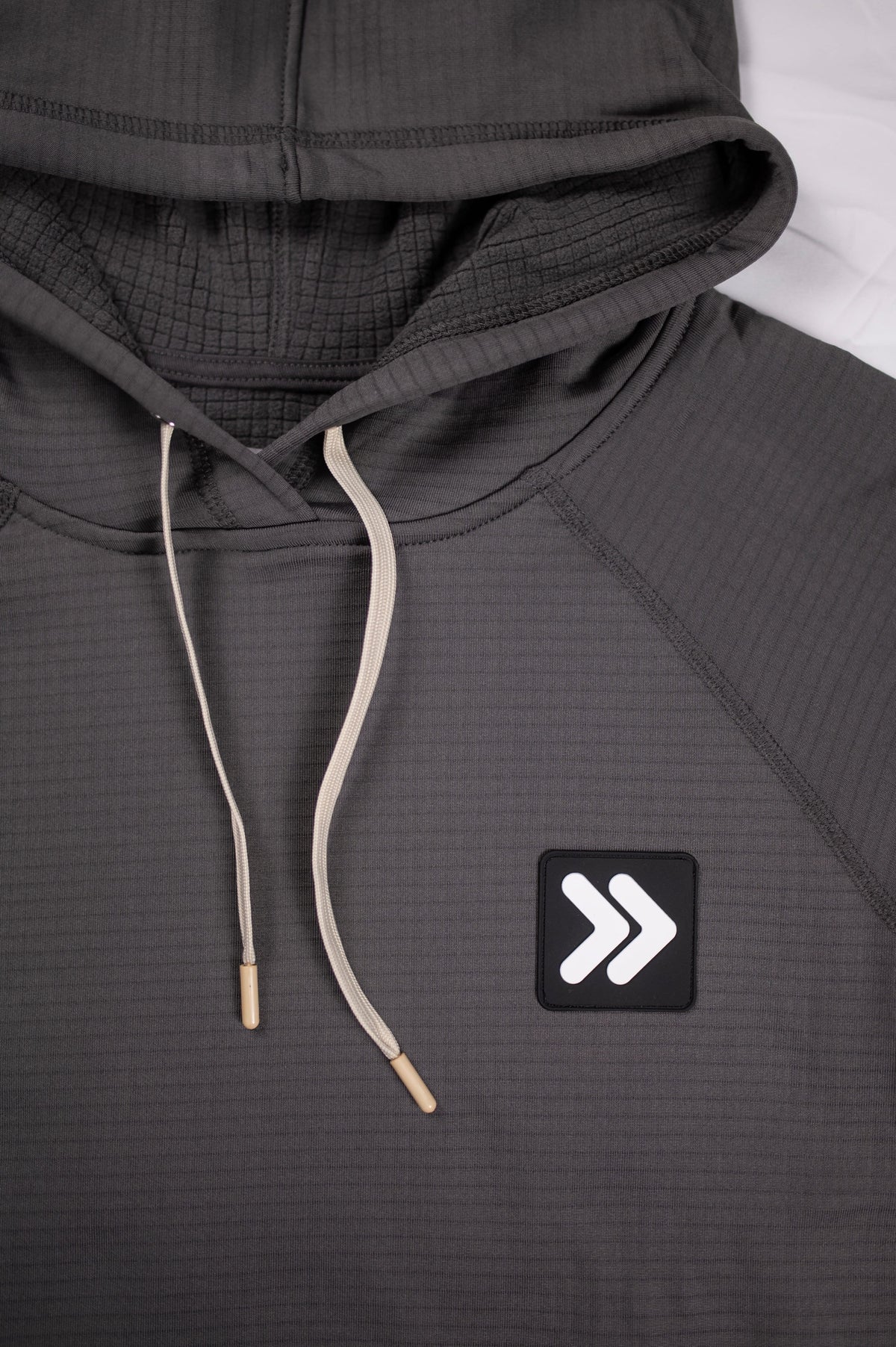 MOVE sport apparel charcoal grey waffle-knit pullover hoodie with adjustable hood, raglan sleeves, and chest logo patch