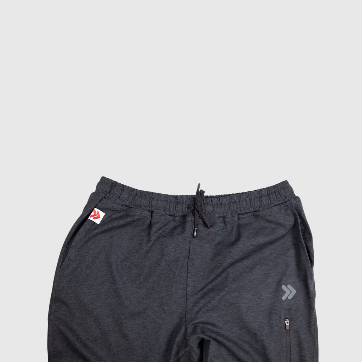 Front waistband detail of MOVE Sport Apparel Men’s Essential Jogger Black Label in Heather Black.