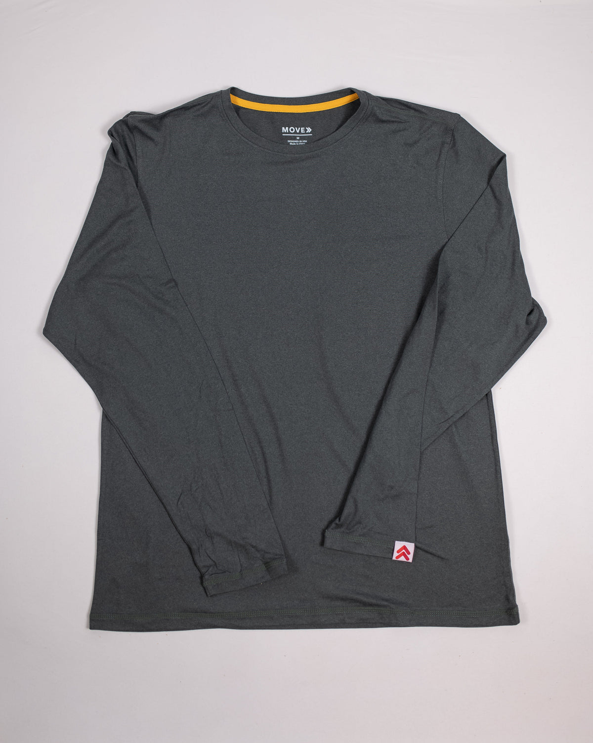 MOVE Sport Apparel Men’s Essential Long Sleeve in Heather Darkest Spruce laid flat, showing the crew neckline and long sleeves.