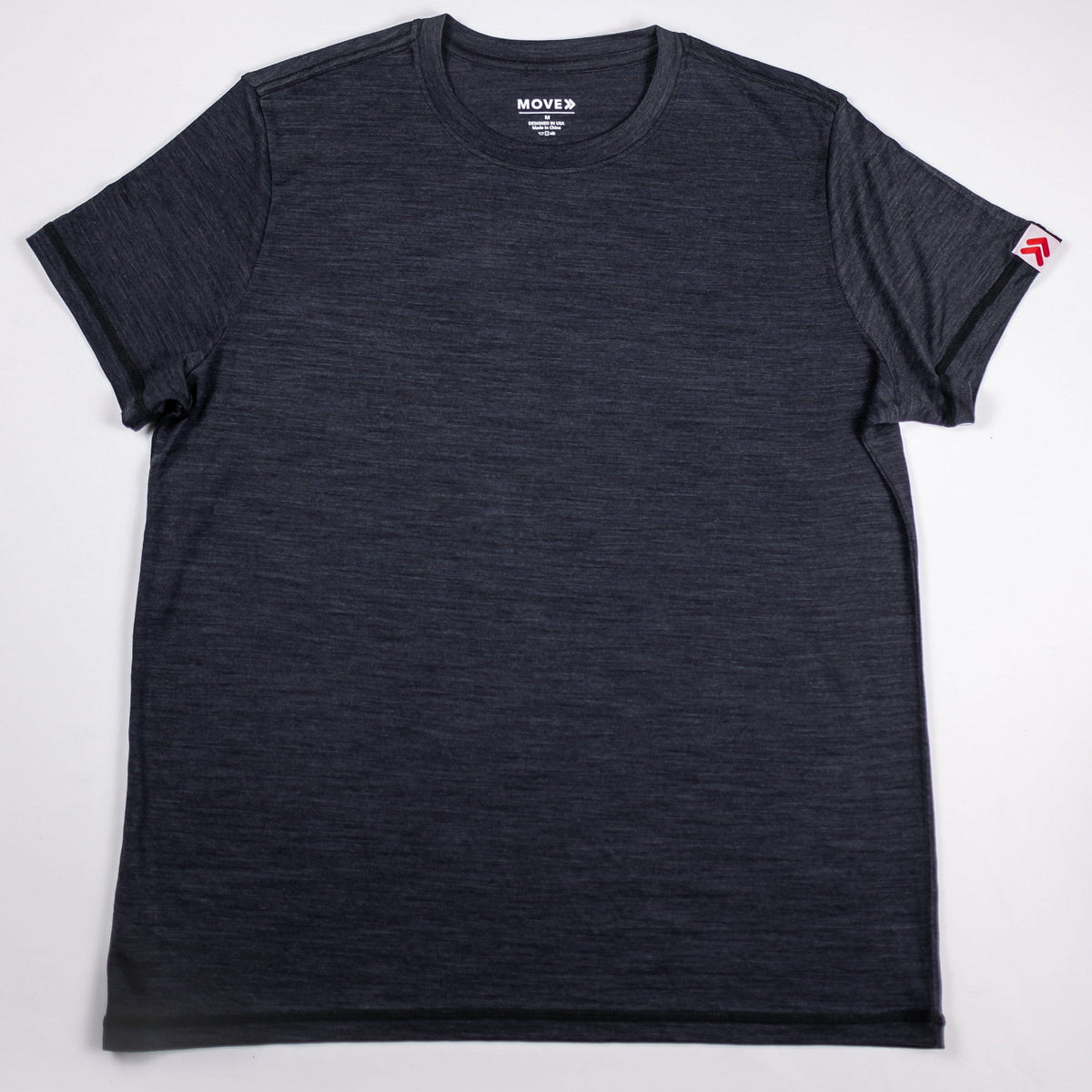 Front view of the charcoal Asphalt MOVE Sport Apparel men’s Merino Short Sleeve with original sleeve tab.